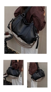 Macro detail of high-capacity black PU leather tote bag with stylish patterned woven strap