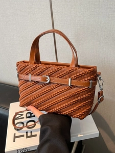 Brown pleated Boston handbag with adjustable shoulder strap and silver metal buckle detail