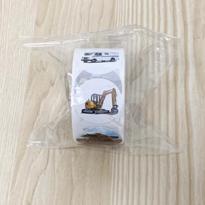 Detail of roll of round reward stickers featuring construction vehicles for children