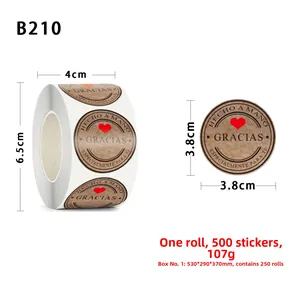 Macro detail of round kraft paper stickers roll featuring Hecho a Mano olive branch design