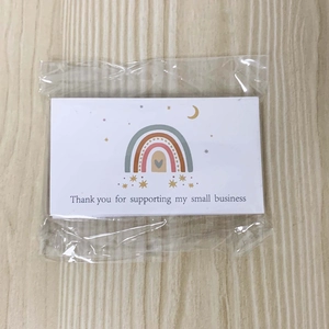 Detail of thank you cards with rainbow design packaged in clear plastic wrap