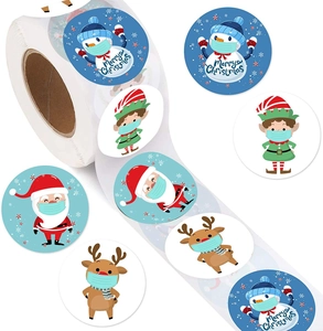 Detail of Christmas roll stickers featuring Santa, snowmen, and elves with Merry Christmas text