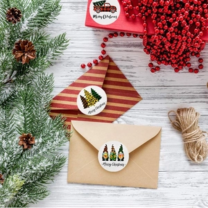 Christmas roll stickers featuring red truck and gnomes on a white wood background