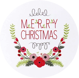 Close-up of circular Merry Christmas stickers featuring red floral and green fern design