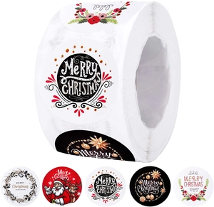 Detailed macro view of various round Merry Christmas adhesive roll stickers for gift wrapping
