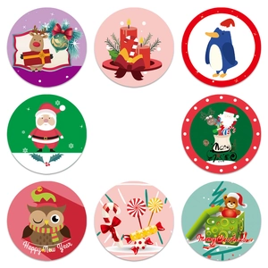 Set of 8 round Christmas stickers featuring reindeer and Santa for gift wrapping