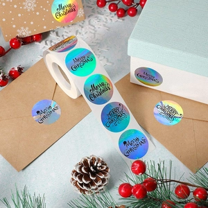 Holographic Merry Christmas roll stickers for festive gift packaging and envelope sealing