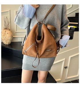 Brown suede hobo shoulder bag with front zipper and matching round pendant coin purse