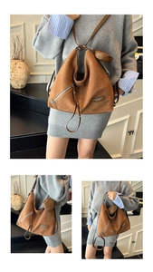 Brown suede tote bag detail with matching round coin purse and leather fashion label