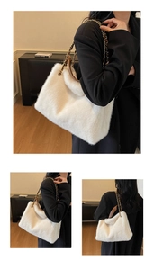 Detail view of white plush tote bag featuring gold chain and brown leather strap