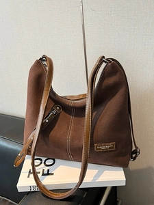 Minimalist large brown suede tote bag with leather straps and decorative stitching