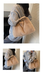 Detail of khaki faux fur tote bag showing metal chain strap and leather handle