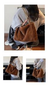 Detail of plush faux fur shoulder bag with gold chain strap in dark brown finish