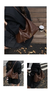 Detail of deep brown faux leather tote bag with natural texture and adjustable strap