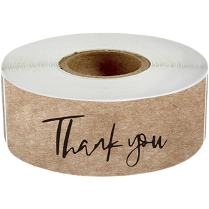 Roll of 1-inch round kraft paper stickers with black Thank You handwritten text