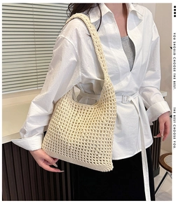 Close-up of beige hollow woven mesh bag showing intricate hand-crocheted cotton details