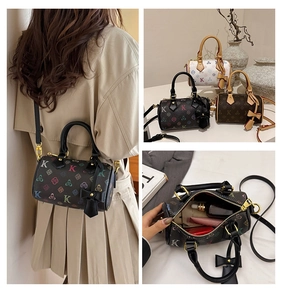 Detailed views of multi-color monogram boston bag showing capacity and crossbody style