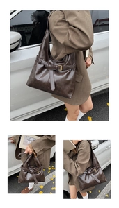 Outdoor street style view of dark brown wax leather tote with metal buckle details