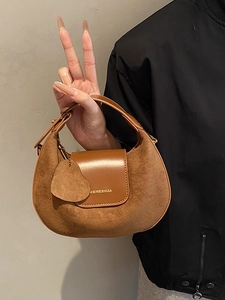 Brown suede crescent handbag for women featuring a minimalist retro underarm design