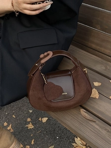 Chic brown suede patchwork half-moon handbag with heart charm and gold-tone logo