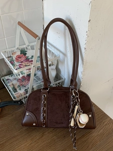 Retro dark brown bowling bag in suede and leather with trendy baseball charms and rivets
