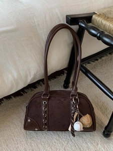 Chic dark brown suede bowling bag for women with baseball charms and metal eyelets