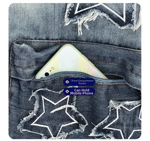 Detail of denim backpack with star-shaped frayed patch and front zipper pocket for phone