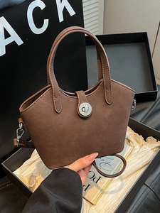 Borsa a secchiello vintage marrone capiente con chiusura a scatto argento e manici