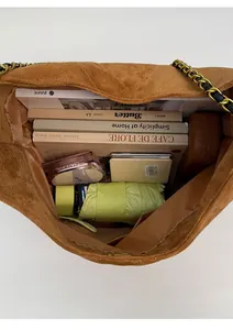 Interior view of brown suede tote bag showing large capacity and chain strap