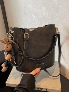 Women Retro PU Leather Bucket Bag With Woven Handle And Rabbit Charm Elegant Shoulder Crossbody Commuter Handbag Purse