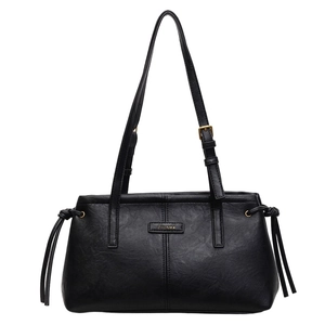 Minimalist black faux leather shoulder bag with gold logo and adjustable straps