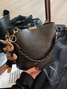 Retro grey leather bucket bag with braided handle and cute bunny pendant for women