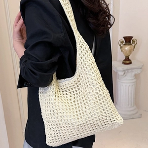 Minimalist beige crochet tote bag with hollow woven texture for beach and shopping