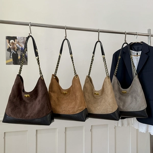 Quilted faux suede tote bags in four colors with gold twist locks and chain straps