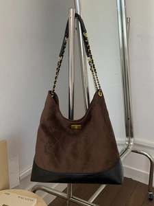 Brown suede tote bag with black leather base, gold chain and diamond quilted pattern
