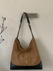 Brown suede tote bag with diamond quilting, black leather trim and chain strap handles