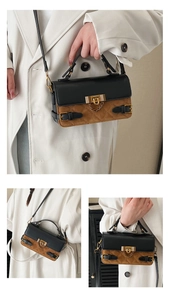 Detail of quilted leather crossbody bag featuring gold twist lock and dual-tone stitching