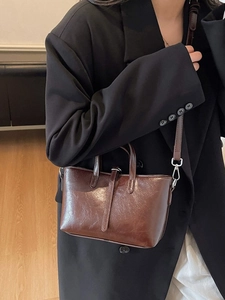 Deep brown vintage oil wax leather tote bag with top handles and detachable strap