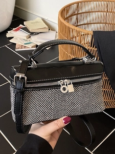 Chic black and white tweed crossbody bag with leather trim and silver hardware details