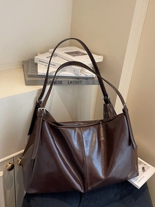 Minimalist large brown tote bag made of soft PU leather for daily commuting and leisure