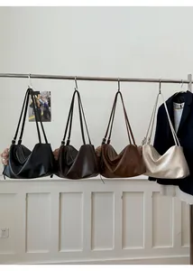 Detailed display of large capacity vintage tote bags in black, brown, and beige colors