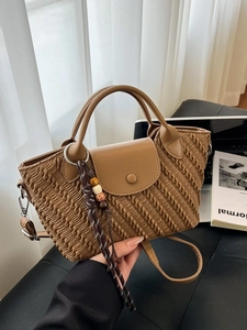 Caramel pleated texture handbag with woven pendant and adjustable shoulder strap