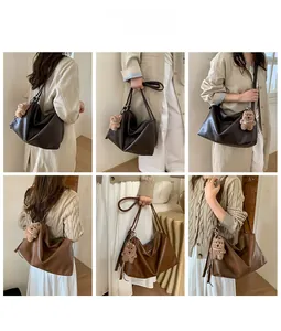 Detail shots of large retro tote bag in dark brown PU leather with plush bear charm