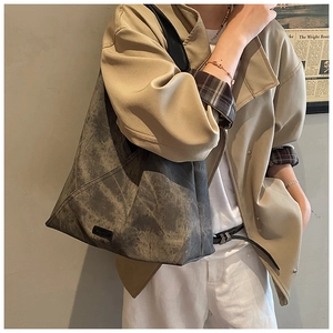 Large gray faux suede tote bag with vintage washed texture and black shoulder straps