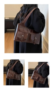 Detailed view of dark brown tote bag with retro buckle pockets and glossy leather finish