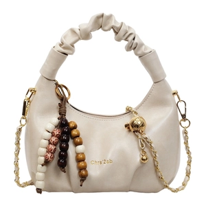 Minimalist soft leather pleated hobo bag in beige with chain strap and beaded charms