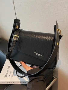 Classic black leather crossbody bag with woven flap detail and stylish wide shoulder strap