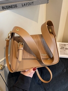 Light brown leather crossbody bag with woven texture flap and stylish wide strap