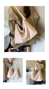 Detail view of large cream hobo bag in matte suede with adjustable shoulder strap