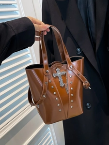 Brown Y2K punk bucket bag with silver cross pendant and rivet studs for women